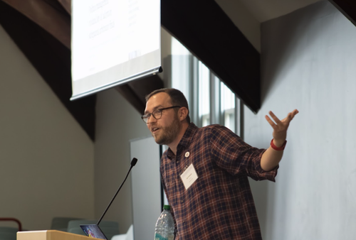 NewsGuild president Jon Schleuss delivers a keynote urging participants to reimagine a collective path forward on AI in newsrooms.